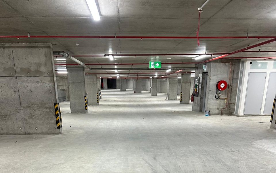 Completed basement car park with off-form concrete walls and columns