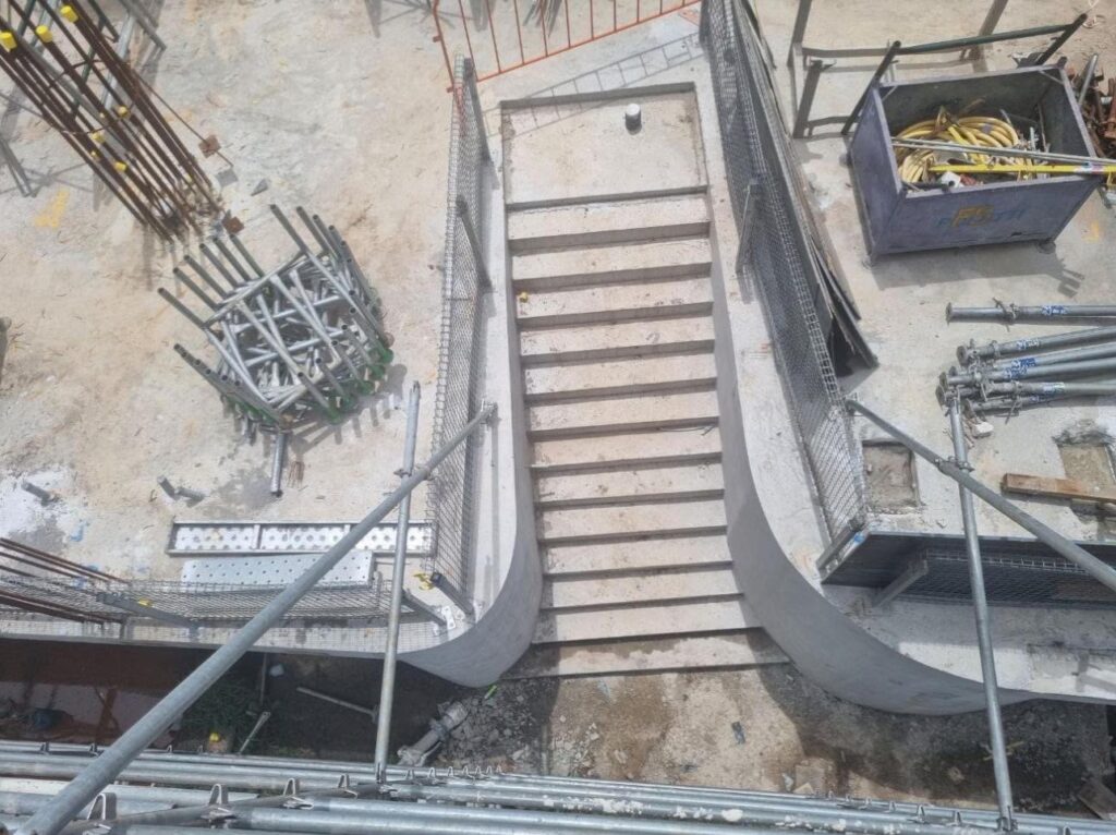 In-situ concrete stair with curved walls formed by Apex