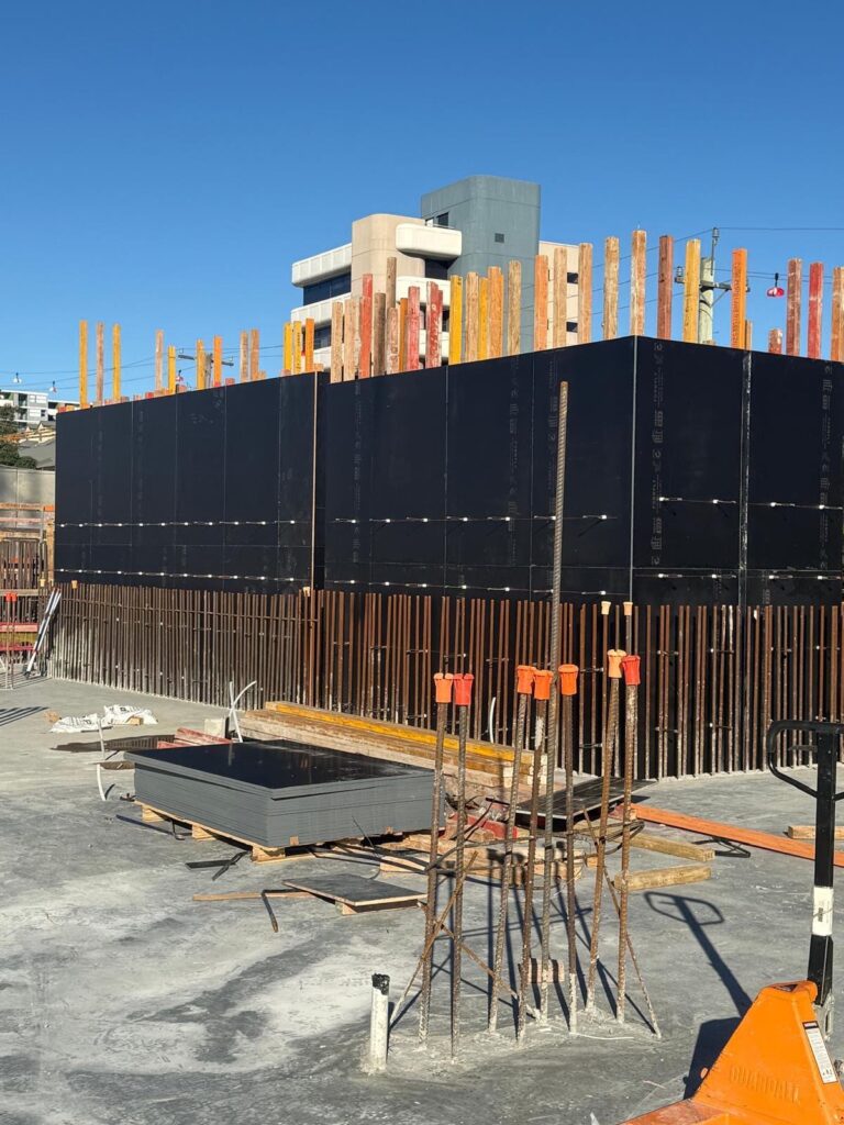 Apex wall formwork with starter bars on a basement level